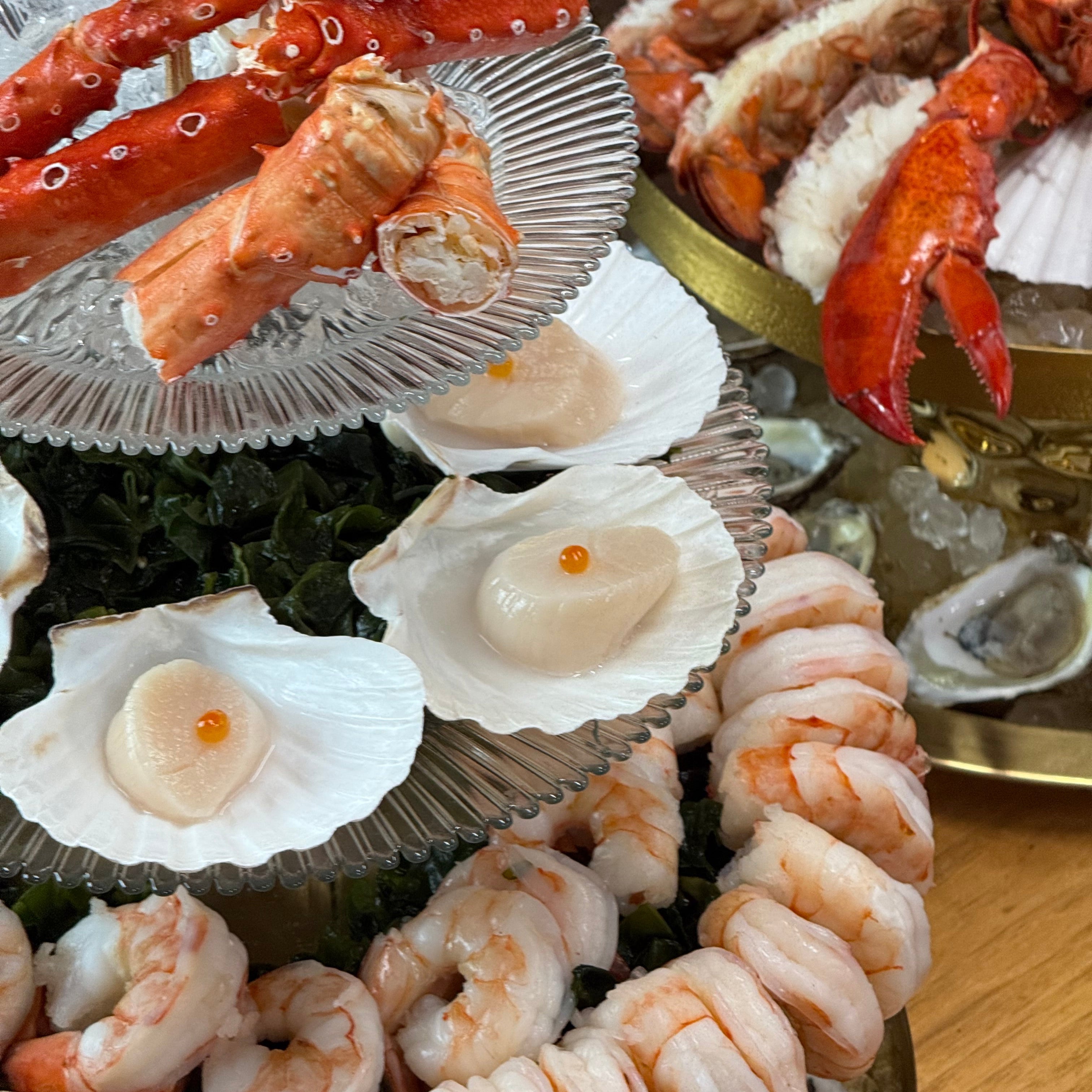 seafood tower, crab, king crab, oysters, scallop, lobster