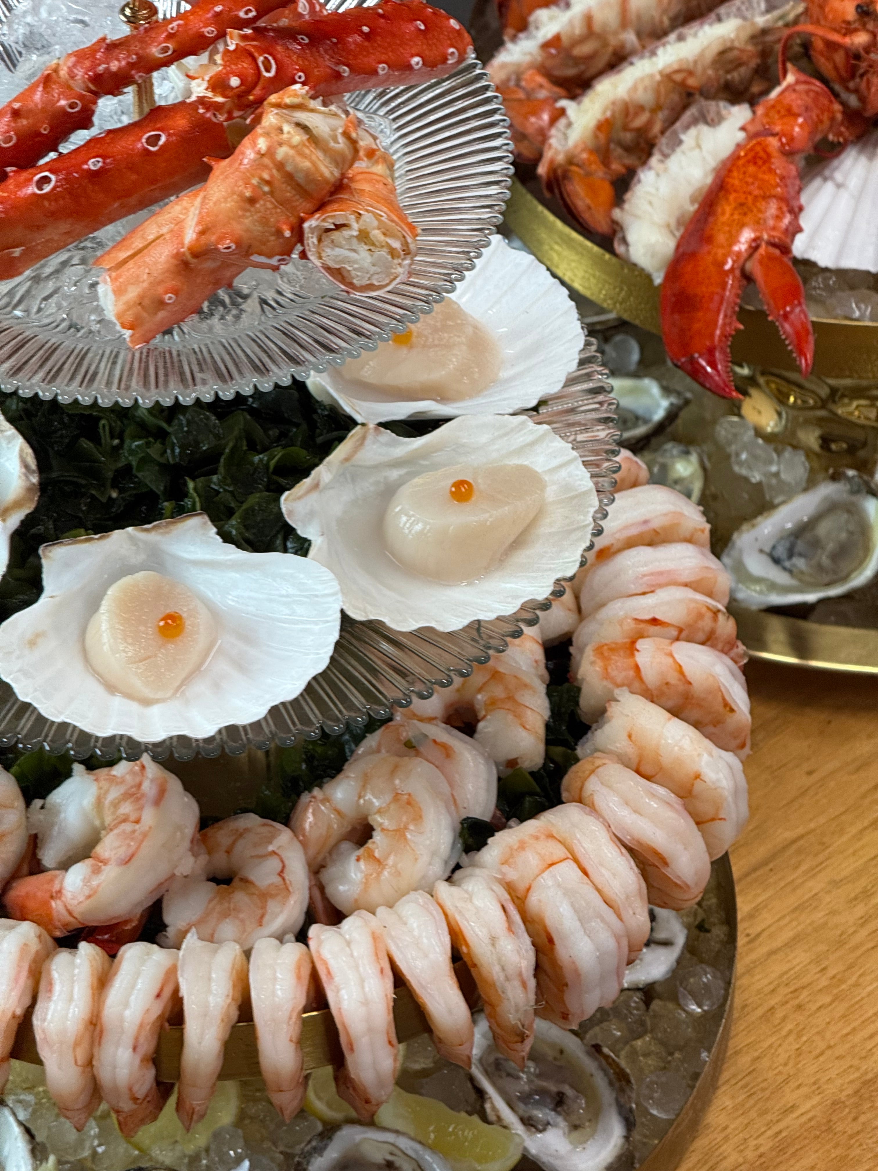 seafood tower, crab, king crab, oysters, scallop, lobster